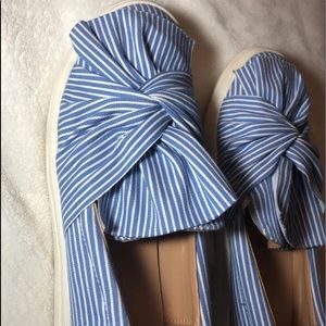 Blue and white striped slip on shoes.